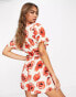 Monki relaxed playsuit with tie front and frill sleeves in poppy print