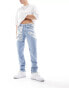 ASOS DESIGN skinny jeans with heavy rips in light wash blue