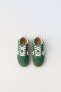 Split suede plimsolls