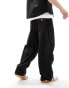 Tommy Jeans nylon parachute pants in black