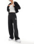 Фото #4 товара Puma T7 oversized woven joggers in black