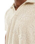 ASOS DESIGN relaxed polo shirt with revere collar in beige floral embossed towelling