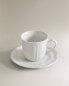 Porcelain teacup and saucer