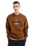 Calvin Klein Jeans monogram logo stencil crew neck sweatshirt in brown