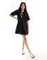 Фото #6 товара ASOS DESIGN waffle tie front smock mini dress in black