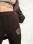 Nicce able flared leggings in brown with split hem