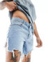 ASOS DESIGN mid length slim denim shorts with heavy ripped hem in light wash blue