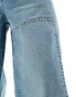 ASOS DESIGN loose jeans with carpenter detail in a mid wash blue