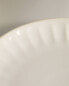 Stoneware dessert plate with raised design