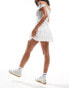 Reclaimed Vintage mini tiered ruffle skort in white