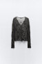 Semi-sheer creased-effect beaded jacket