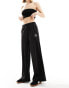 Фото #1 товара Puma Classics ribbed relaxed trousers in black