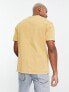 ASOS DESIGN relaxed t-shirt in washed yellow with cowgirl chest print