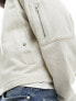 ASOS DESIGN oversized jersey jacket with stud pocket detail in beige