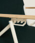 Folding beach chair with wooden arm rests