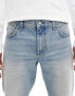 ASOS DESIGN tapered jeans in mid wash blue tint