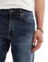 Фото #3 товара ASOS DESIGN stretch tapered jeans in light wash blue