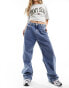 Фото #8 товара Tommy Jeans Daisy low waisted baggy jeans in mid wash