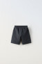 Jogging bermuda shorts with label detail