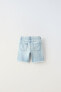 Ripped denim bermuda shorts