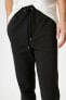 Фото #9 товара Брюки мужские Koton Модель Классические со шнурком в поясе и карманами Slim Fit