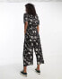 Monki tie waist jumpsuit in black and white puzzle print