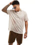 ASOS DESIGN relaxed polo shirt in beige with multi sun prints