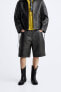 Vintage-effect leather bermuda shorts