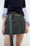 Waxed mini skirt with belt