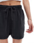 Фото #5 товара ASOS DESIGN unisex shorter length slim shorts in washed black