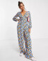 Фото #2 товара ASOS DESIGN bubble crepe button back long sleeve jumpsuit in blue floral