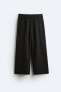 Trousers with contrast double waist