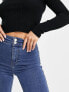 Topshop Petite high rise Jamie flare jeans in mid blue