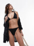 Фото #1 товара Topshop textured tie side bikini bottoms with bead detail in black