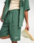 Фото #1 товара Kickers baggy fit green muslin shorts with tie waist and embroidered logo co-ord