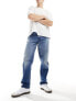 Lee Oscar relaxed tapered fit distressed jeans in mid vintage wash