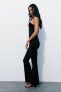 Flared polyamide asymmetric jumpsuit