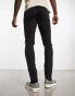 ASOS DESIGN skinny jeans with rips in in black