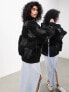 ASOS EDITION – Oversize-Bomberjacke aus Kunstleder in Schwarz mit Patchwork-Design