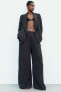 Creased-effect palazzo trousers