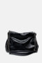 Rocker shoulder bag with flap