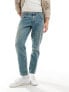 ASOS DESIGN tapered jeans in tinted light wash blue