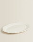 Earthenware serving dish with raised-design edge