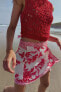Мини-юбка парео с узором и цветочным принтом ZARA