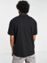 ASOS DESIGN relaxed fit polo with clasp detail in black