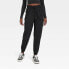 Фото #1 товара Women's Lined Winter Woven Joggers - All in Motion Black M
