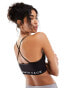 The North Face Training seamless performance sports bra in black Exclusive at ASOS