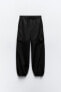 Nylon trousers with zips