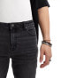 ASOS DESIGN skinny jeans in black with vintage tint