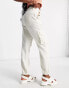 Фото #8 товара Miss Selfridge baggy cargo pant with elasticated hem in stone